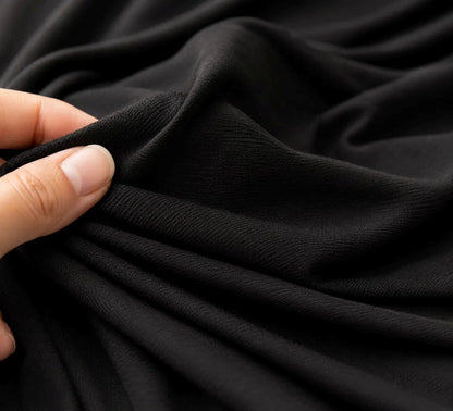 Gros plan sur le tissu extensible doux de l'écharpe de portage NEVA