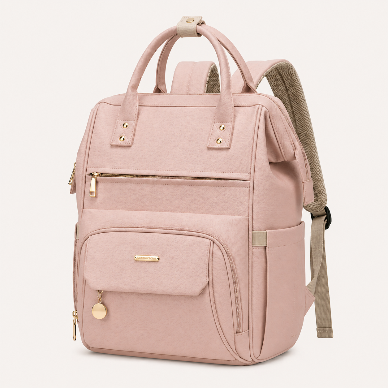 Sac à langer maternité NEVA Paris rose poudré avec finitions dorées sur fond blanc