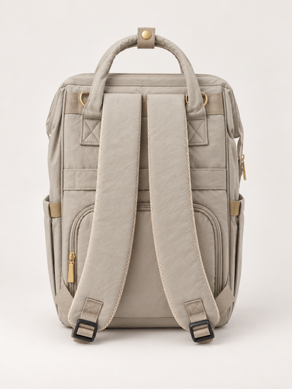 Dos du sac à langer NEVA L'Essentiel, bretelles rembourrées réglables et bande passe-valise.