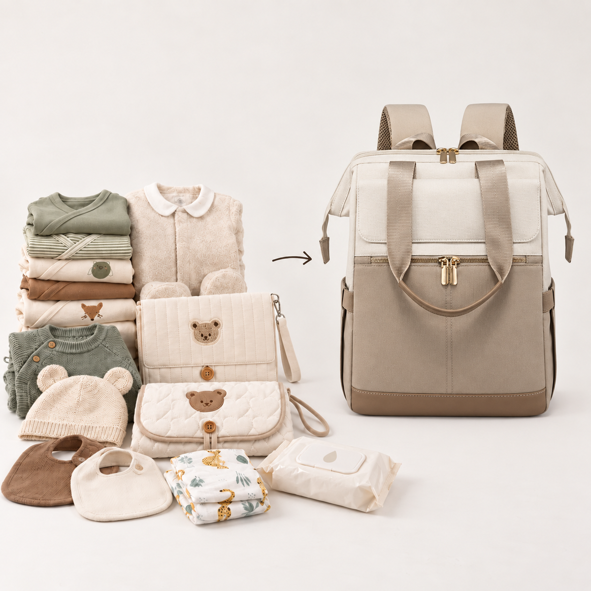 Vêtements de bébé, couches, lingettes et matelas à langer posés à côté du sac à langer Sérénité