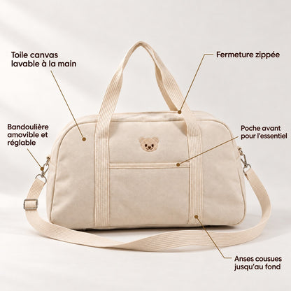 Détails du sac à langer week-end NEVA Teddy : poche avant, fermeture zippée, anses cousues, bandoulière amovible et toile canvas