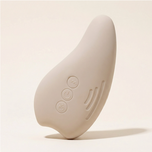 Masseur lactation chauffant et vibrant Neva Paris – vue de profil, silicone médical beige, 3 boutons de contrôle
